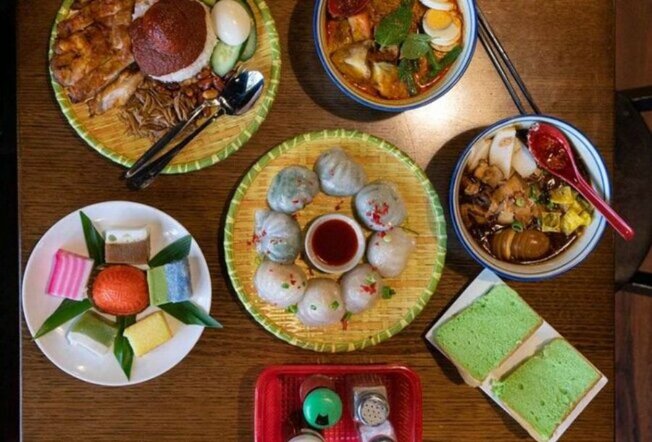 Bowls of dumplings, desserts and soup on a table.