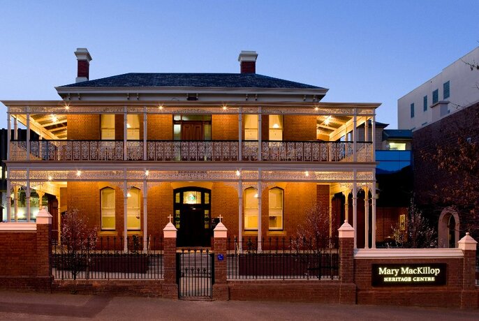External of double storey Victorian building, at dusk.