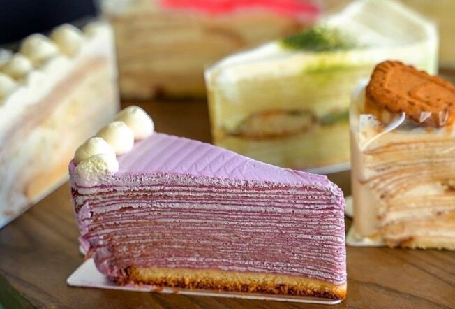 Various flavoured slices of crepe cake. 