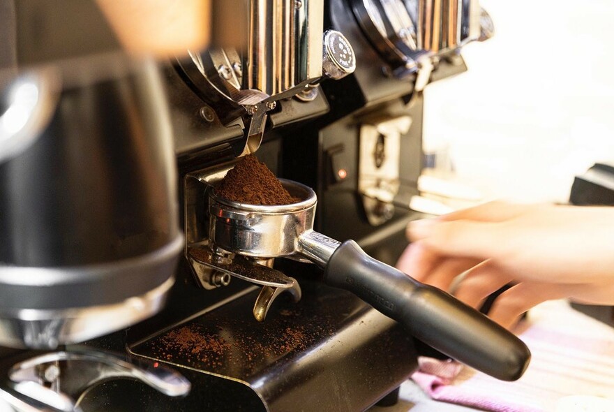 Ground coffee in an espresso machine.