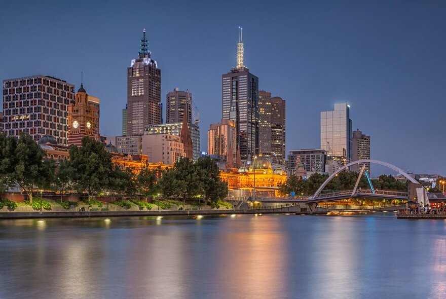 The Melbourne city skyline taken from the Yarra River at dusk. 