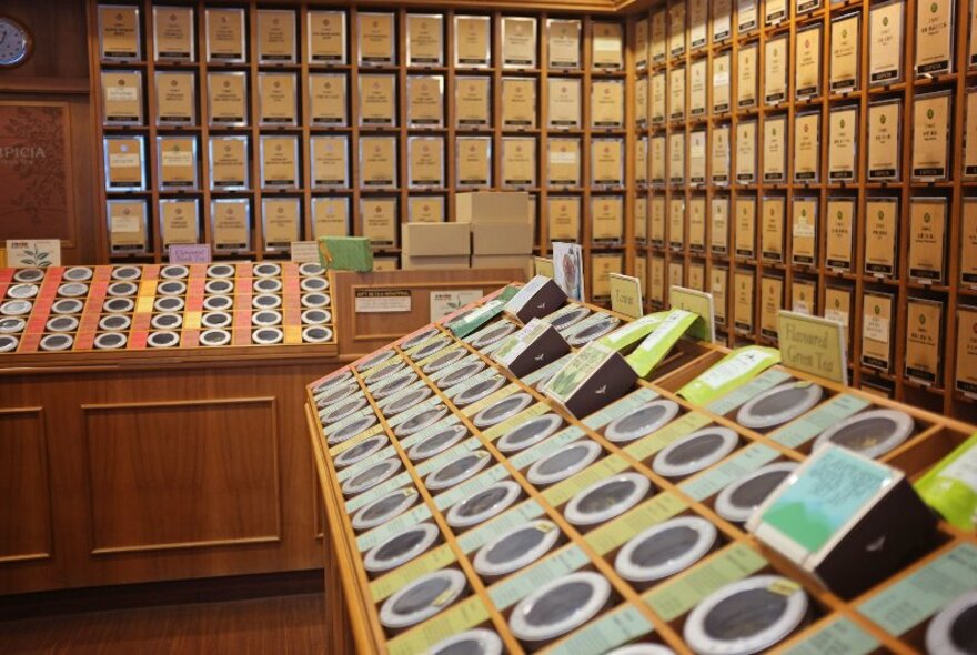 Interior of Lupicia Fresh Tea showing many different varieties of tea in small containers.