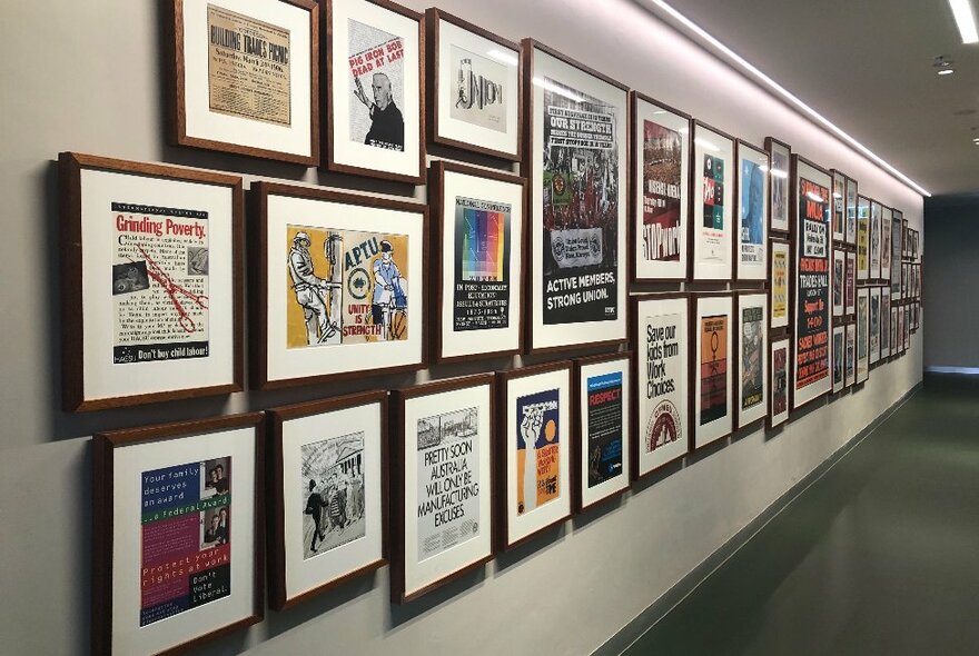A gallery wall covered in framed posters.