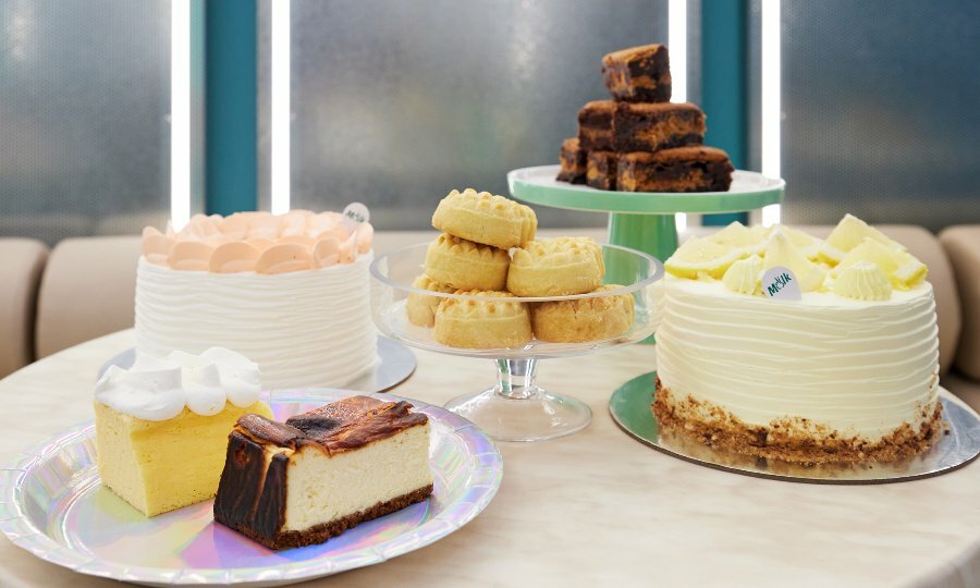 A selection of cakes and cookies on a table