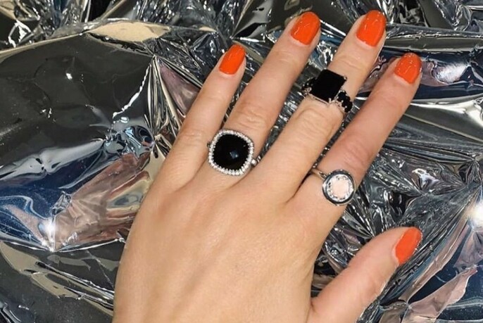 Three different rings, including two square black ones.