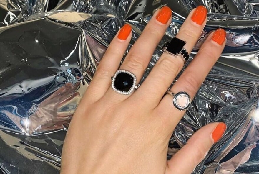 Three different rings, including two square black ones.