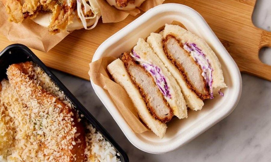 A chicken sandwich in a container