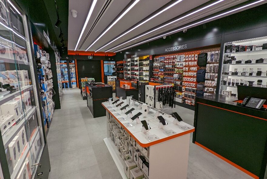 digiDirect interior with walls and units displaying cameras and other digital products.