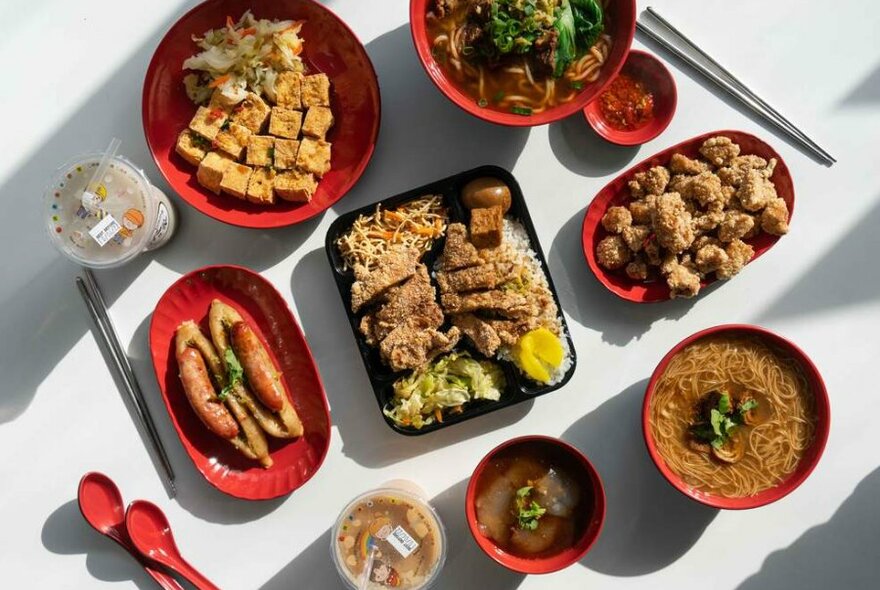 Trays of street food on a white table