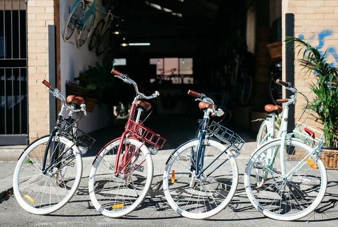 Four authentic Dutch bikes displayed outside the Lekker storefront.