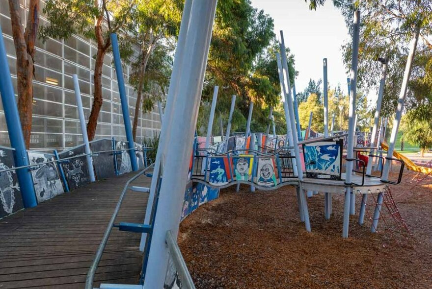 A walkway at a children's playground covered with paintings. 
