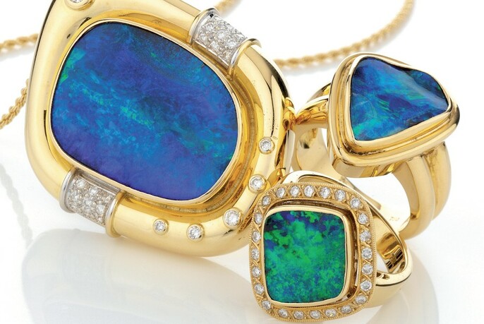 Gold necklace and rings with blue and green opals and diamonds.