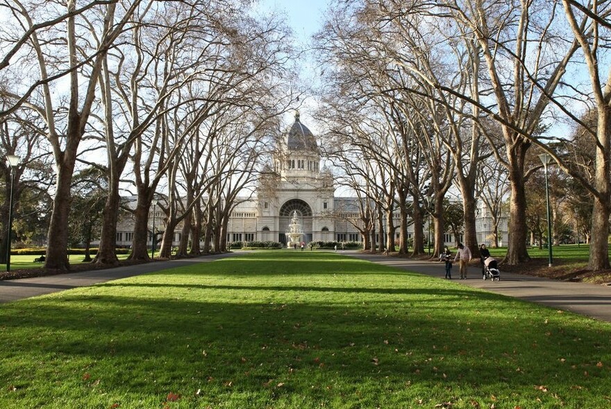 Royal Exhibition Building, lawn and trees in  and Carlton Gardens.