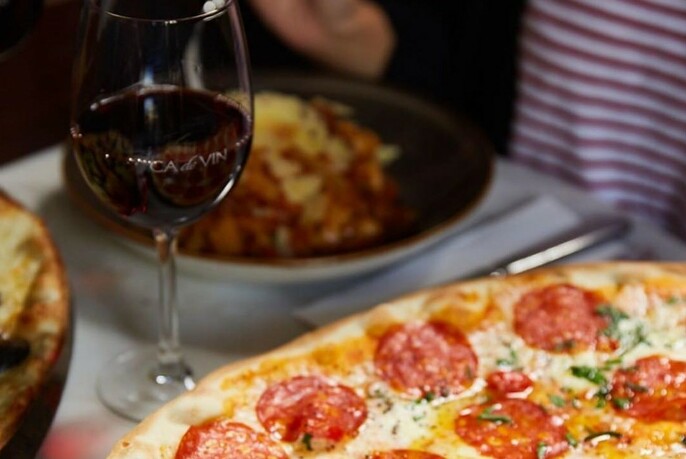 Pizza and glass or red wine.