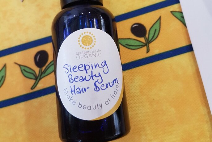 A bottle labelled Sleeping Beauty Hair Serum.