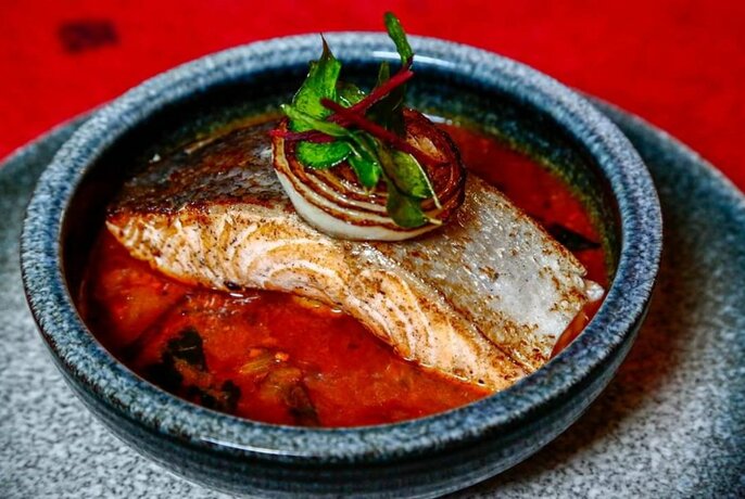 Fish curry in a bowl.