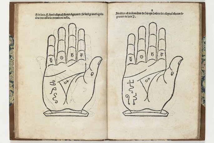 Open book with sketched palm of hand on each page.