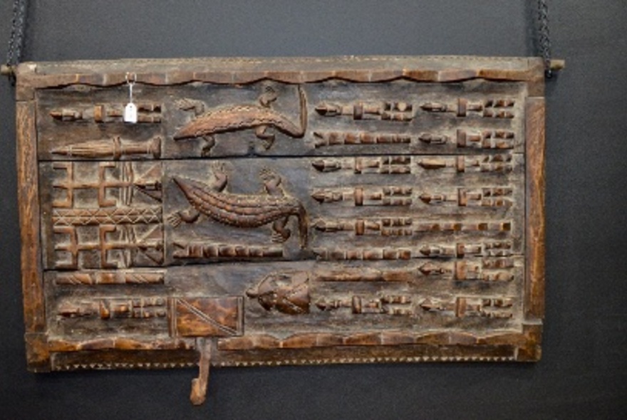 Carved wooden wall hanging.