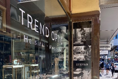 The front window of the Trend Optic shop with block lettering.