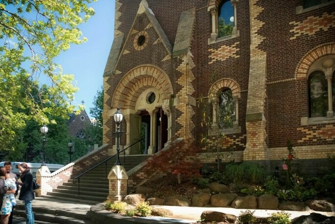 Romanesuqe architecture of historic St Michael's Uniting Church with patterns made by two colours of brick.