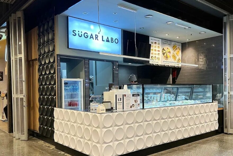 Sugar Labo small outlet at QV shopping centre, showing display and serving counter, and a large menu on the wall.