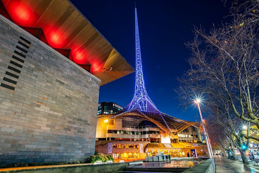 A building with a large glowing spire on top.