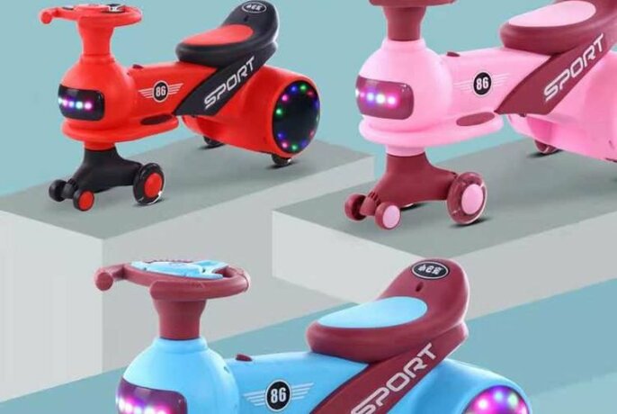 Three electronic tricycles for young children in bright colours.