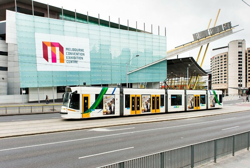 Exterior of Melbourne Convention and Exhibition Centre with a tram in front.