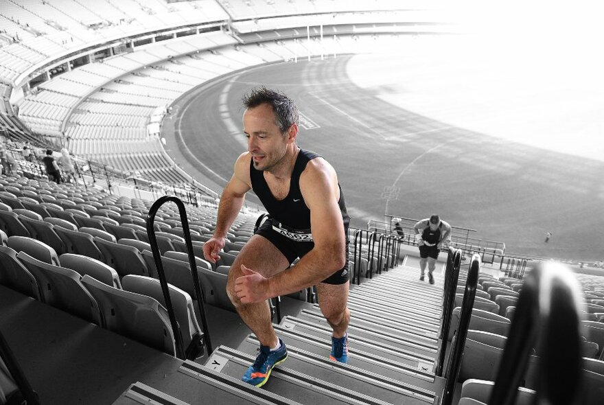 Male runner racing up the MCG stairs.