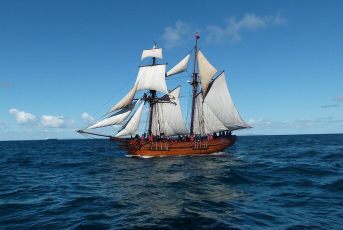 A timber two-masted, topsail schooner, the Enterprize Tall Ship.