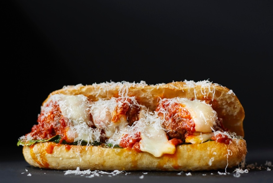 A focaccia filled with meatballs, melted cheese and grated parmesan.