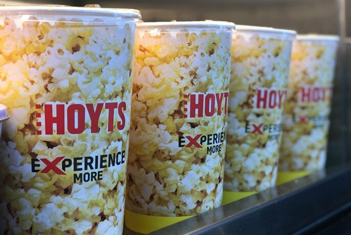 Four large buckets of Hoyts popcorn