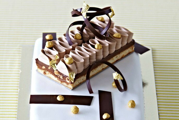French patisserie with biscuit base , chocolate and cream decoration.
