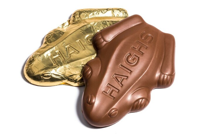 Two chocolate frogs, one wrapped in gold foil.