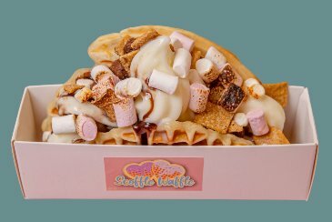 Waffle with small white and pink marshmallows, upright, in small white box.