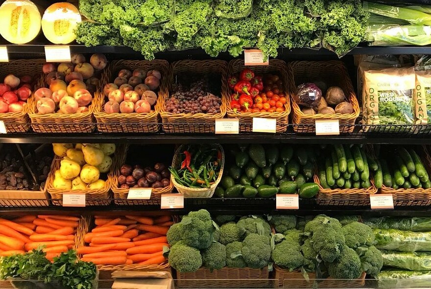 Organic vegetables for sale on shelves.