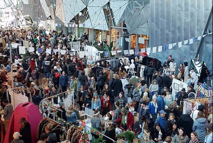 Aerial view of large crowds at an outdoor market at Fed Square.