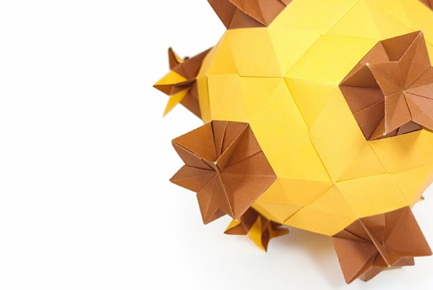 Yellow and brown origami globe.