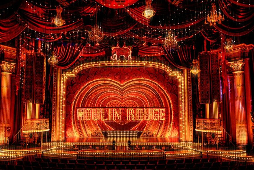 Stage set as the Moulin Rouge.