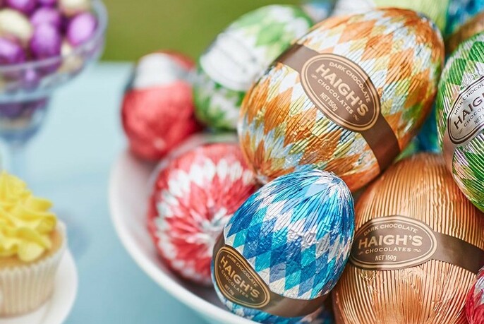 Chocolate Easter eggs covered in brightly-coloured foil.