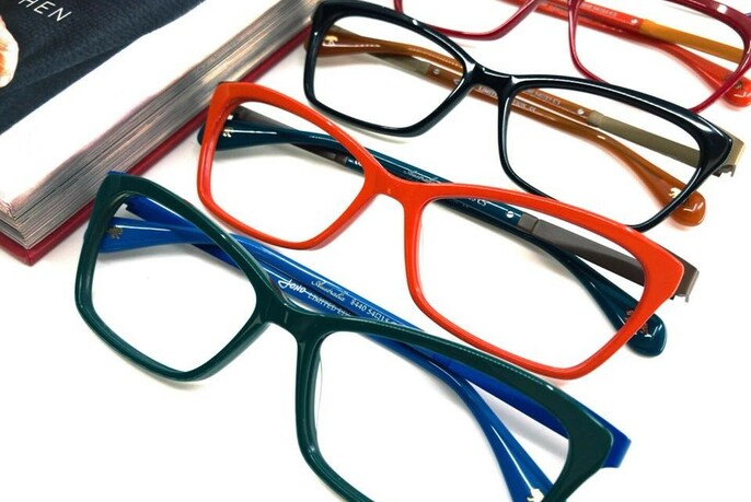 Several pairs of glasses with different coloured frames.