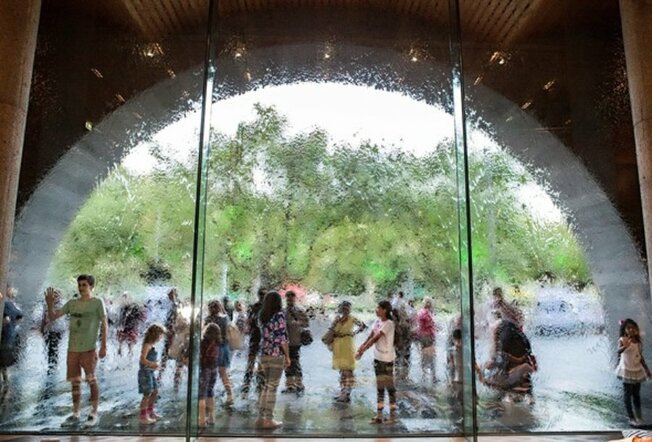 Kids standing out the front of the NGV water wall.