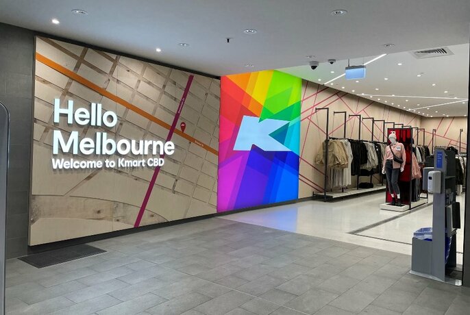 Entrance foyer to Kmart store at Kmart Centre with wall signage displaying the words HELLO MELBOURNE WELCOME TO KMART CBD.