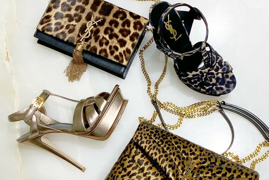 Leopard-print handbags and sandals on a white background.