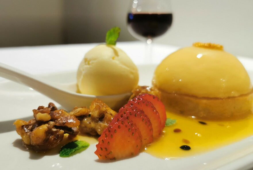 Mouse and ice cream dessert with strawberries and walnuts.