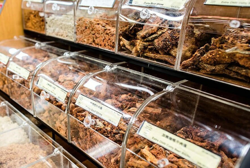 Various dried foods in 'pick and mix' selection containers.