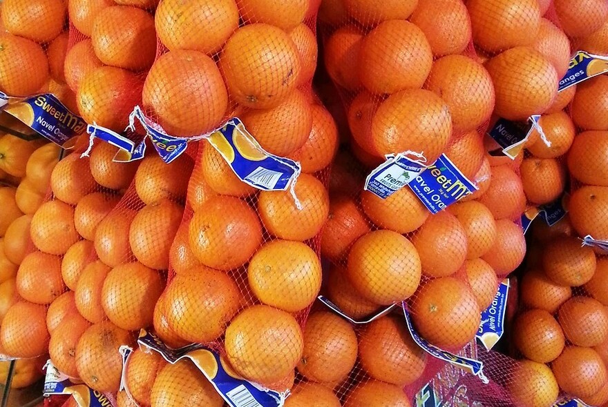 Net bags of oranges.