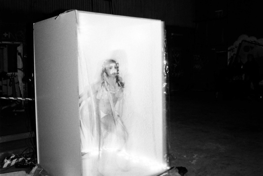 The figure of a woman set in a box, like ice. 
