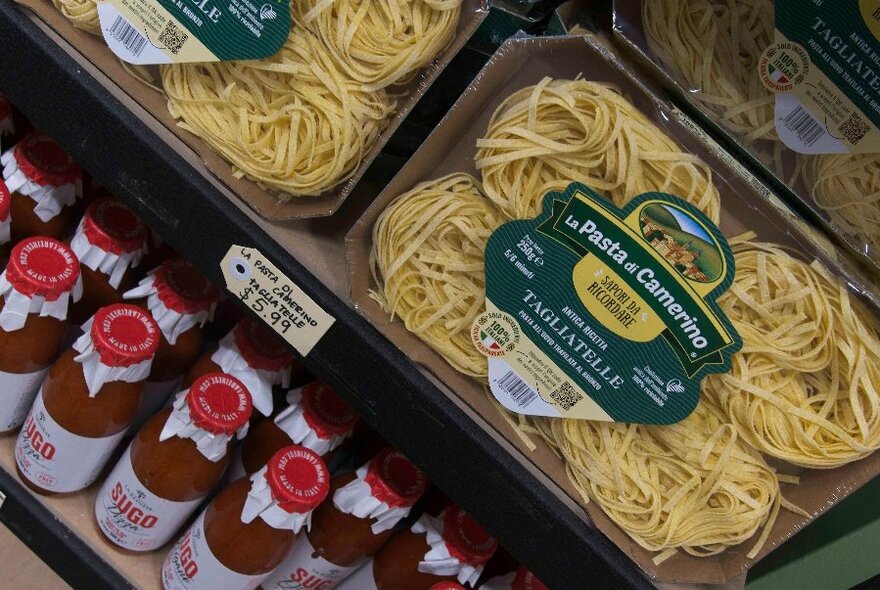 Pasta and bottled tomato sauce available for sale. 