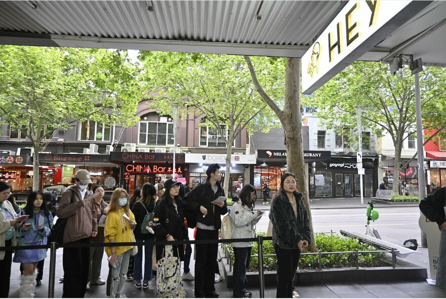 A line of customers waiting to buy tea from Heytea, Chinese global tea sensation.